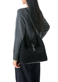Haute Shore Sandy Hobo Handbag in Woven Black Faux Suede