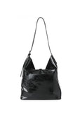Haute Shore Sandy Hobo Handbag in Black Faux Leather