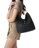 Haute Shore Sandy Hobo Handbag in Black Faux Leather